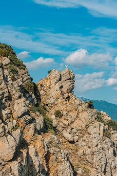 The sculpture of a white eagle stands on a rock in Gaspra near the Swallow's Nest on the ledge of the rock of Burun.