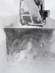 Clearing snow with a snowblower