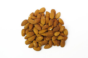 Raw almonds in the peel on a white background. Brown almonds top view. a bunch of raw nuts.