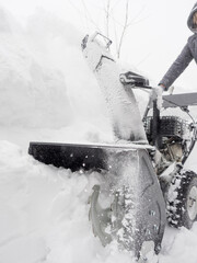 Clearing snow with a snowblower