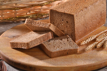 toast wheat integral bread sliced on rustic background.