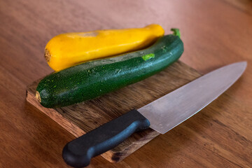 cucumber and knife on cutting board