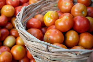 red tomatoes in market, basket