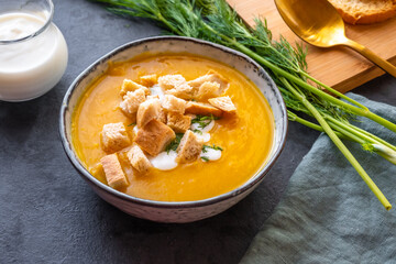 Creamy pumpkin soup with vegetables and spices.