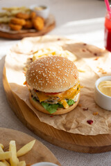 Cheeseburger with French fries and cheese sauce