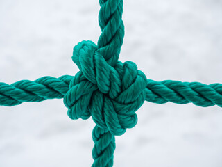 A knot on a thick green nylon rope