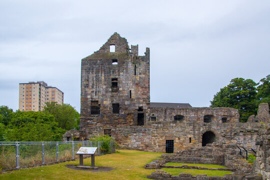 Ruin of Ravenscraig Castle in Kirkcaldy, Scotland, front of the West Tower on Left surrounded by modern blocks of flats