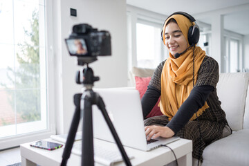 Muslim girl having video content streaming with quality photo