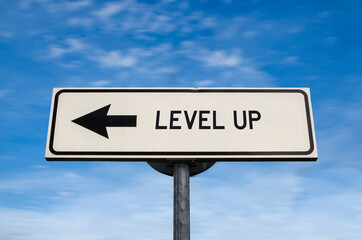 Level up road sign, arrow on blue sky background. One way blank road sign with copy space. Arrow on...