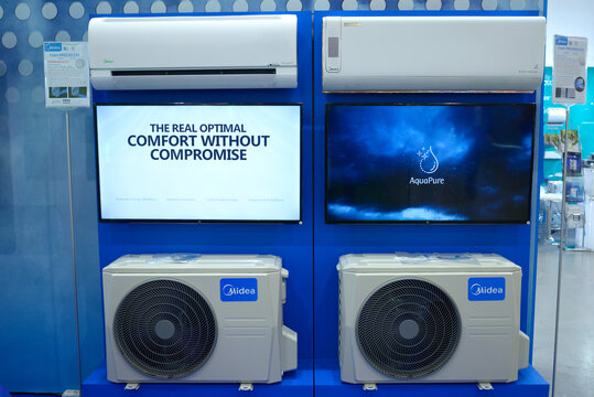 Modern air conditioners Midea set on stand during an exhibition