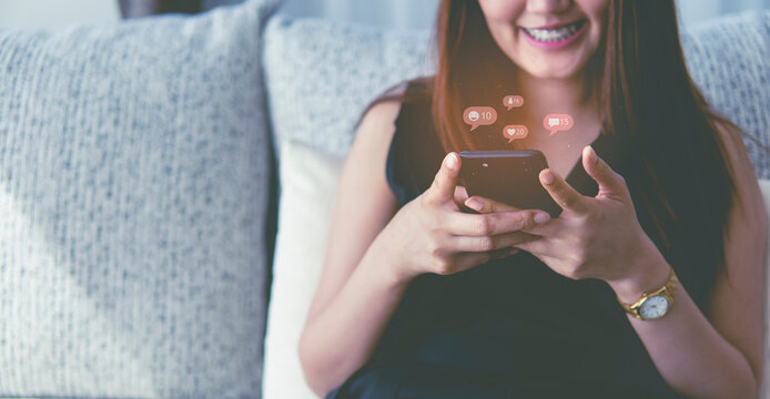 Concept of social medial  women holding smartphone with social medial icon. 