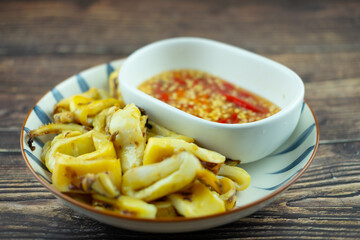 Grilled squid popular street food in Thailand.