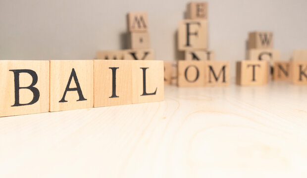The word bail is from wooden cubes. Background from wooden letters.