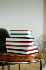 On the Table of the red wood color store memories. A stack of photo book albums with photos of different colors. Stylish books with important events.