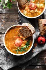 Soup with vegetables and red lentils. Vegan soup with beans and tomatoes.