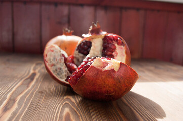 Pomegranate fruit on a wooden background.