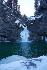 Naklejka premium Waterfall in winter scenery amazing