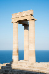 Beutiful view of the Acropolis at Lindos, Rhodes, Greece, on a sunny day. Mediterranean sea as background
