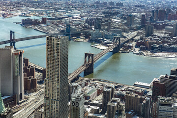 Obraz premium Aerial view of New York City with Manhattan skyscrapers and streets and Manhattan and Brooklyn bridge