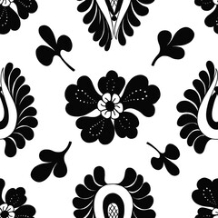 Classic black and white seamless pattern of leaves and flowers. Fashionable ornament for fabric, wallpaper, scrapbooking.