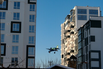 little plane between buildings