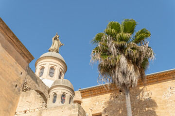 Sculpture of the Sacred Heart crowning a dome