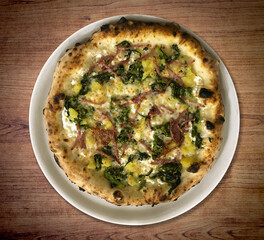 Italian Pizza with zucchini, potatoes, mozzarella and bacon.