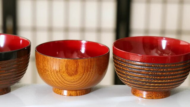 Variation of Japanese lacquered bowls in a row