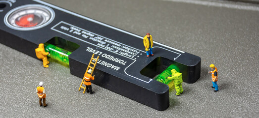 Maintenance worker at a construction site accuracy level