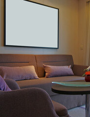 Living room of balcony suite cabin stateroom in clean modern cozy interior design with desk, arm...