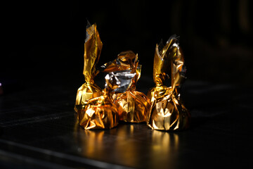 Chocolate candies in a golden wrapped packet