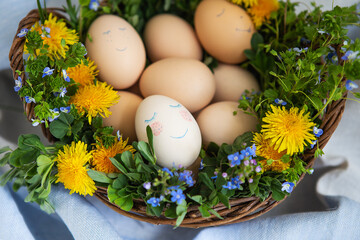 Beautiful spring bouquet in a wooden basket with painted Easter eggs.