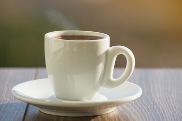 A cup of aromatic espresso coffee on a table in a cafe.