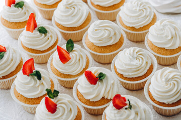 Cupcakes with strawberries and blueberries. Selective focus.