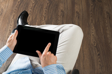 Obraz premium businessman with a tablet, works in the office