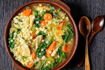 chicken kale veggies soup in a bowl