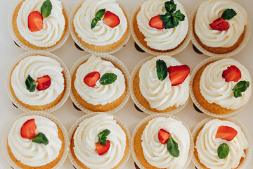 Cupcakes with strawberries and blueberries. Selective focus.