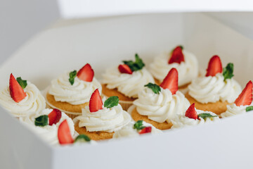 Cupcakes with strawberries and blueberries. Selective focus.