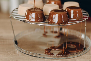 Baker decorating dessert, by filling chocolate on it.