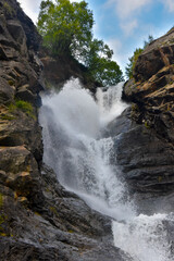 Fototapeta premium Large and small rivers and waterfalls in North Ossetia against the backdrop of majestic mountains. Republic of North Ossetia - Alania