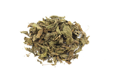 Pile of Dry Tulsi leaf or holy basil tea isolated on white background. Ayurvedic medicine in India. Tulsi tea drink for health.