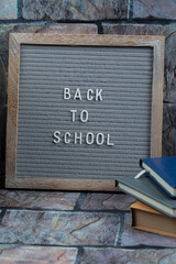 Back to school poster embedded on grey background