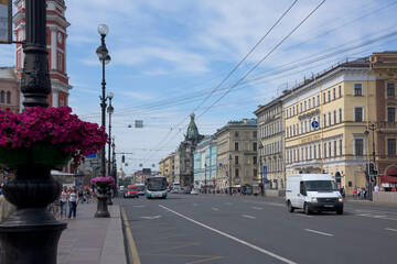 Fototapeta na wymiar Nevsky Avenue with moving on it pedestrians and cars