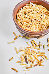 Bowl of crackers on white background