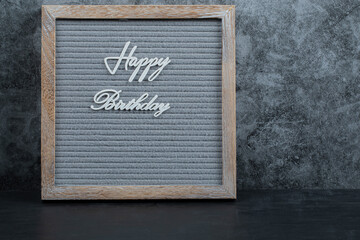 Happy birthday phrase embedded on the grey tissue