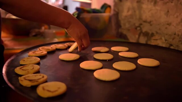 Row of small sopes on a black surface