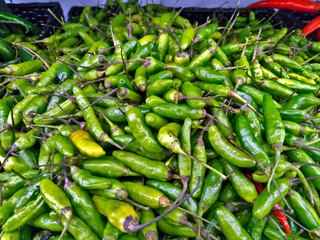 Stacks of Green Cayenne Pepper are on display for sale