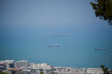 Fototapeta na wymiar Haifa, Israel, 05,06,2017 Mountain view of the city and the sea coast on a bright sunny day