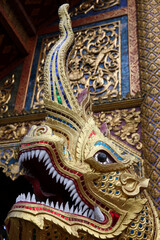 Fototapeta na wymiar Naga statue in Wat Chedi Luang naga, Chiang Mai. Thailand. 25.02.2017