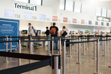 Close up of check-in area with belt control queue at international airport Vienna Austria. Queue...